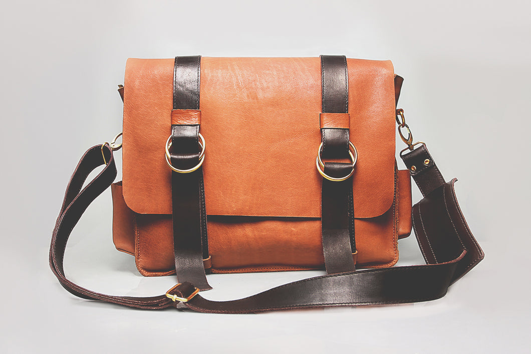 Brown authentic leather office bag, fiber handle for durability.